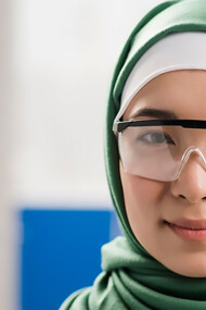 Female scientist with hijab posing in the lab