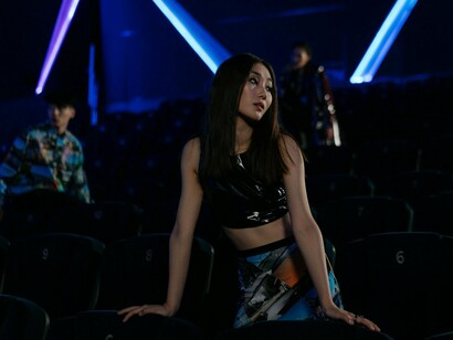 A modern street-style look with neon light in the background, symbolising the fearless self-expression inspired by K-pop fashion