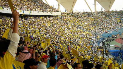 The Al-Nassr fans fill the King Fahd Stadium in Saudi Arabia, creating an electric atmosphere with their passionate support