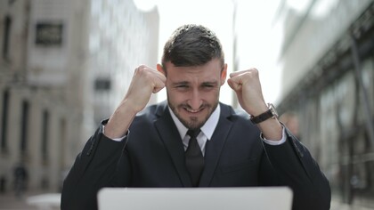 Man in suit celebrating success