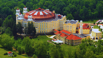 A panoramic view of the legendary West Baden Springs Hotel, Indiana, showing the harmony between architectural brilliance and natural beauty