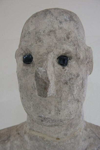 In the mid-1990s, archaeologists uncovered the Urfa Statue—the oldest surviving life-sized human sculpture—beneath the Old City of Urfa near Balıklıgöl. The site formed part of a large Pre-Pottery Neolithic settlement, evidenced by distinctive terrazzo floors and period-specific flint artifacts, Türkiye