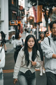 Young Korean students walking on the street while studying abroad