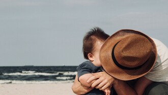 Father and son spending a day at the beach together, a blissful relationship