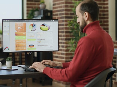 A data analyst reviewing performance metrics and audience trends, representing the growing role of analytics in entertainment decision-making