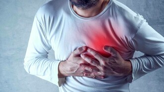 A man clutching his heart which is carrying a disease