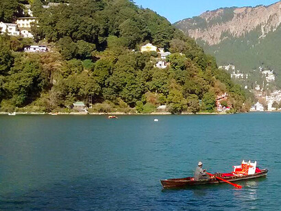 Nainital Lake is a popular boating site, with the Naina Devi Hindu Temple on its northern shore. The beautiful lake resort town nestles amidst seven hills in a lush valley at an altitude of 1,938 metres