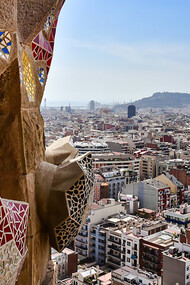 A breathtaking view from the top of the Basílica i Temple Expiatori de la Sagrada Família, overlooking the vibrant cityscape of Barcelona, Spain