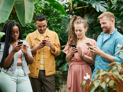 Friends gathered to spend time together but focused on their phones rather than each other
