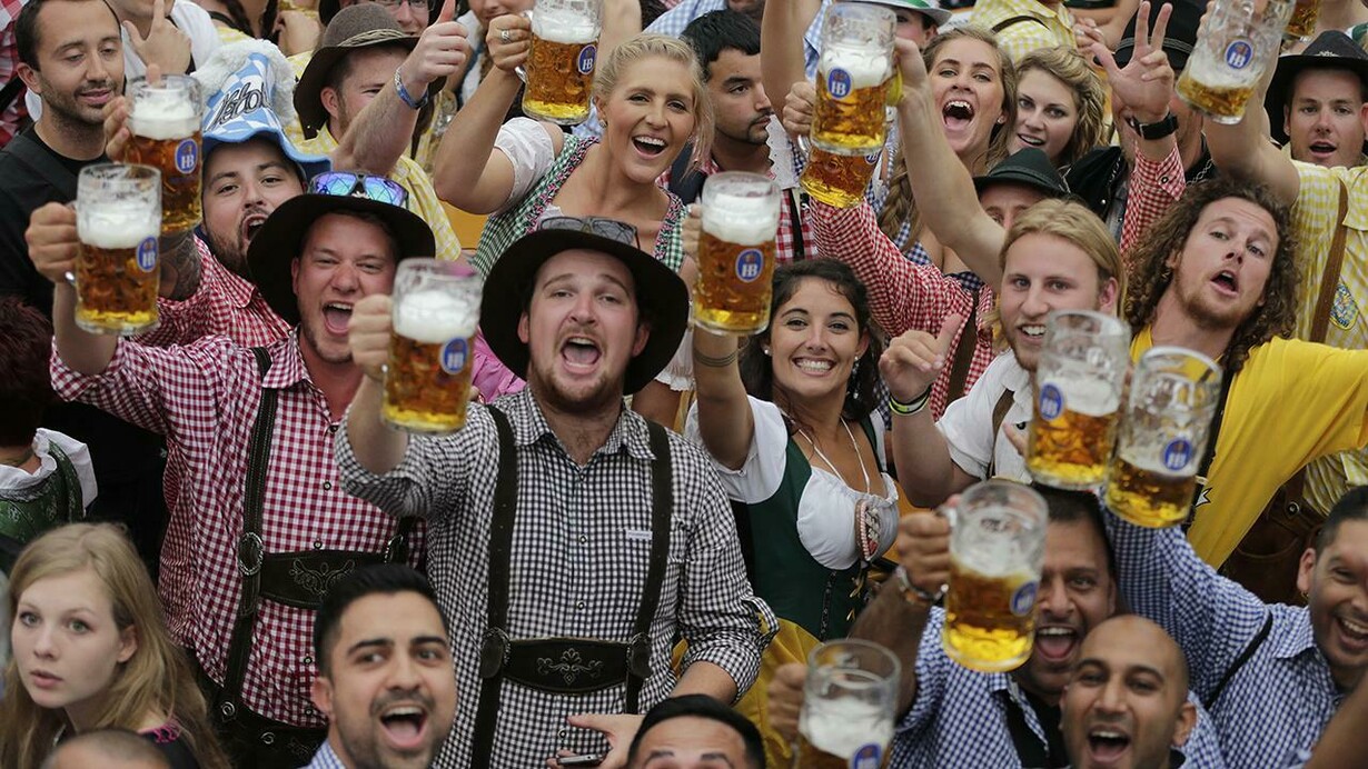 People celebrate Oktoberfest in traditional outfits