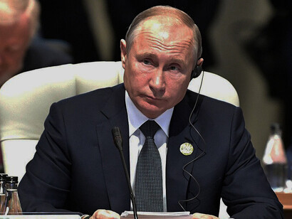 Vladimir Putin attended a narrow-format meeting during the 2018 BRICS summit, where leaders from Brazil, Russia, India, China, and South Africa discussed global cooperation and development