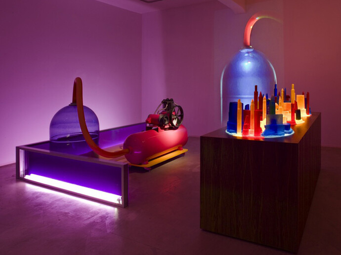 Mike Kelley, Kandor 4, 2007, Mixed media with video projection, Part 1 with bottle: 161.3 x 325.1 x 242.6 cm / 63 1/2 x 128 x 95 1/2 in, Part 2 with cities: 142.2 x 265.7 x 95.3 cm / 56 x 104 5/8 x 37 1/2 in, Overall dimensions variable, © Mike Kelley Foundation for the Arts.  All Rights Reserved/Licensed by VAGA, New York, Courtesy the artist and Hauser & Wirth, Photo: Fredrik Nilsen

