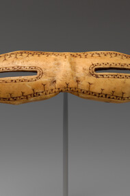 Snow goggles, dating from circa 800–1200, carved from walrus ivory and measuring 1 1/8 × 5 inches (2.9 × 12.7 cm), are part of the American Wing collection at the Metropolitan Museum of Art, USA