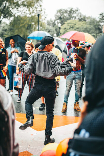 Performer dancing in the rain during a political protest