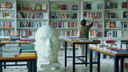 In a sanctuary of knowledge, she delves into the art of questioning assumptions, sharpening her critical thinking skills