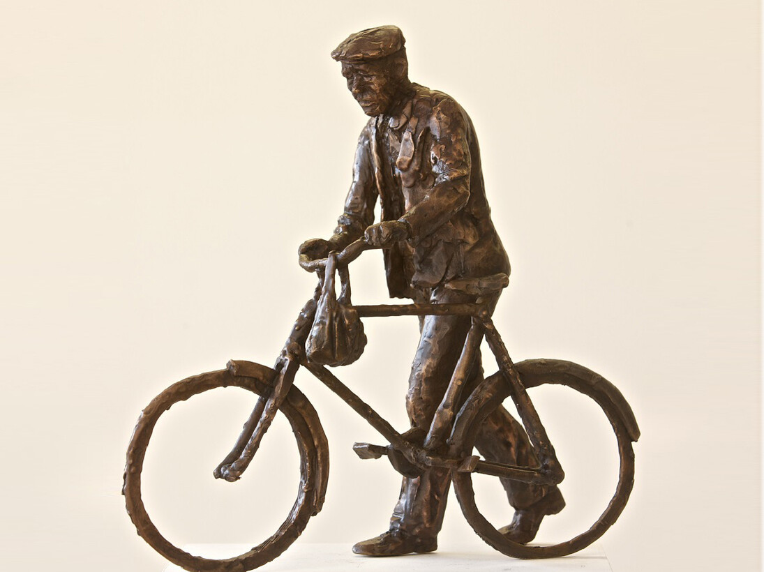 Man Pushing a Bicycle