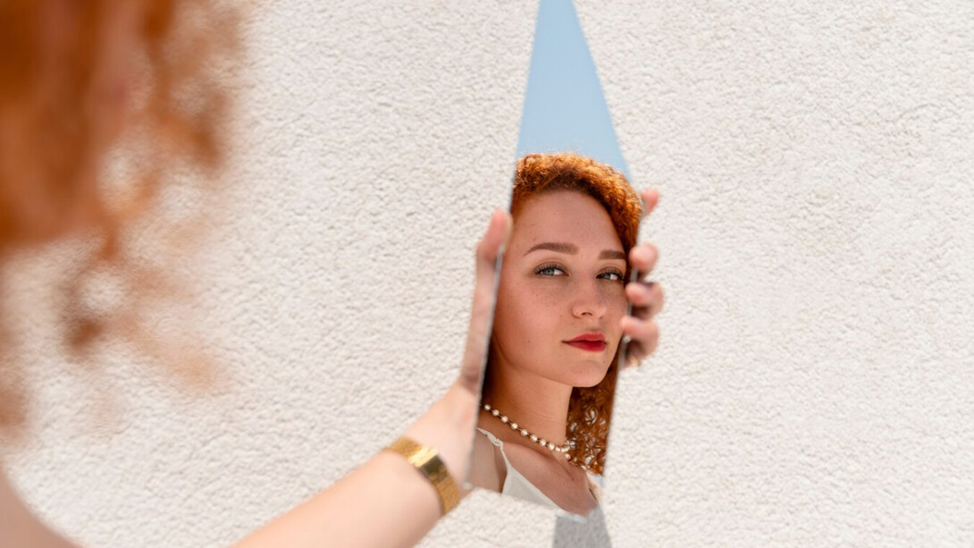 A women facing herself in fragments, identity is not reclaimed all at one, but rediscovered piece by piece in unexpected places