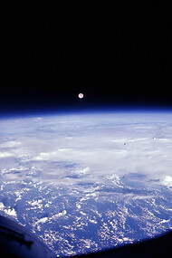 The full moon seen over Earth, photo taken by Gemini 7, 1965