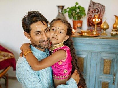 A young girl holding on to her father as a sign of her Electra complex