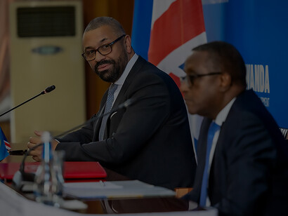 In Kigali, Rwanda, 2023, Home Secretary James Cleverly and Rwanda's Minister of Foreign Affairs and International Cooperation, Vincent Biruta, formalize a new treaty, propelling forward the UK-Rwanda Migration and Economic Development Partnership