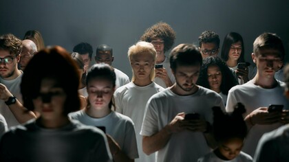 A group of people sharing the same space but removed from each other
