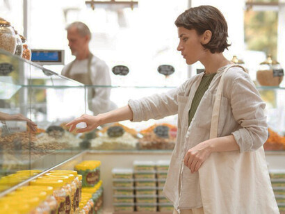 An individual explores diverse offerings at a local producer, highlighting nutritional preservation and innovative food packaging