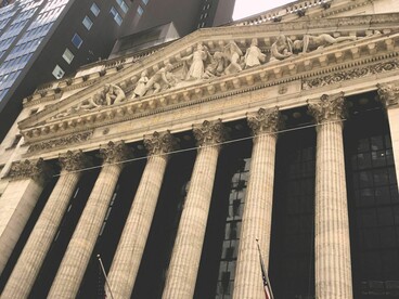 Capitalist systems operate on an amoral premise of endless growth and unregulated wealth accumulation, an environment that inherently deforms democracies and destroys community equality. New York Stock Exchange Broad Street facade