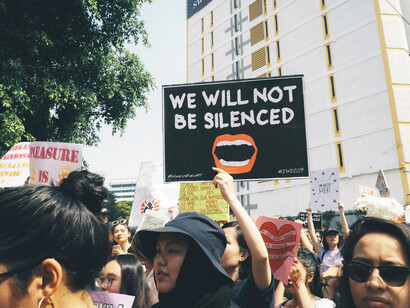 People rallying in the streets at the Women's March 2019 in Dataran Merdeka, Kuala Lumpur, Malaysia