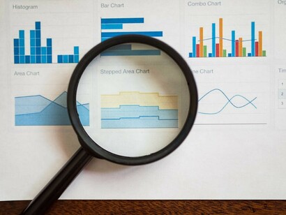 A top-down view of charts and infographics illustrating key concepts in data visualization, digital marketing, and brand storytelling