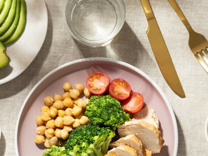 A delicious and nutritious meal that includes avocado, tomatoes, greens and chickpeas 