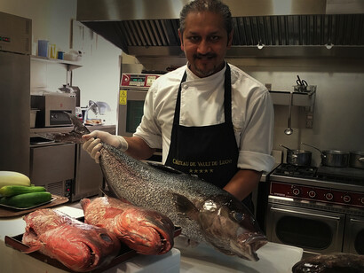 Franco Bowanee preparing fresh fish at the Château de Vault-de-Lugny