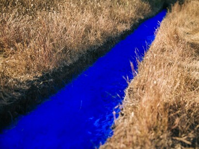 Lita Albuquerque's “Malibu Line,” an ultra-vivid blue earthwork that connects earth, ocean, and sky in Malibu, California, USA