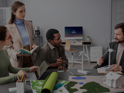 Visualize innovation and collaboration as researchers explore alternative energy sources, gathered around a table in a meeting, driving progress and sustainable solutions forward