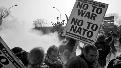 The photo from the NATO protest in Strasbourg, France in 2009, featuring a "No to War, No to NATO" banner