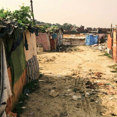 Unsafe structures used as housing located on a dirt road