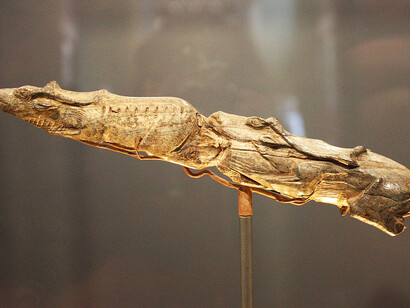 Dating back some 13,000 years, this intricately carved sculpture of two swimming reindeer—made from the tip of a mammoth tusk—is one of the finest examples of Ice Age art. Created at the end of the Last Ice Age, when mammoths, reindeer, and wolverines still roamed Europe, it now resides in the British Museum, UK