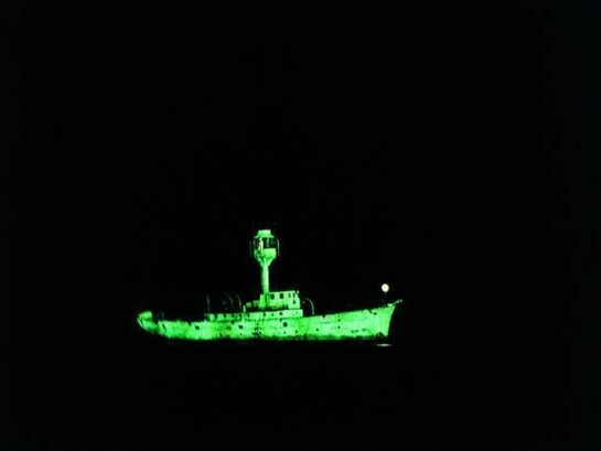 Dorothy Cross, Ghost Ship, 1999 , Two light ship models, phosphorescent paint and u.v.lights, video, 10 minute loop, Collection Irish Museum of Modern Art, Purchase, 2003
