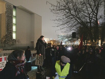 A woman facing a crowd of protesters at a rally demanding the ban of the far-right AFD political party in Berlin, January 2024