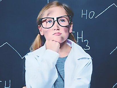 Little girl thinking about new chemical bond