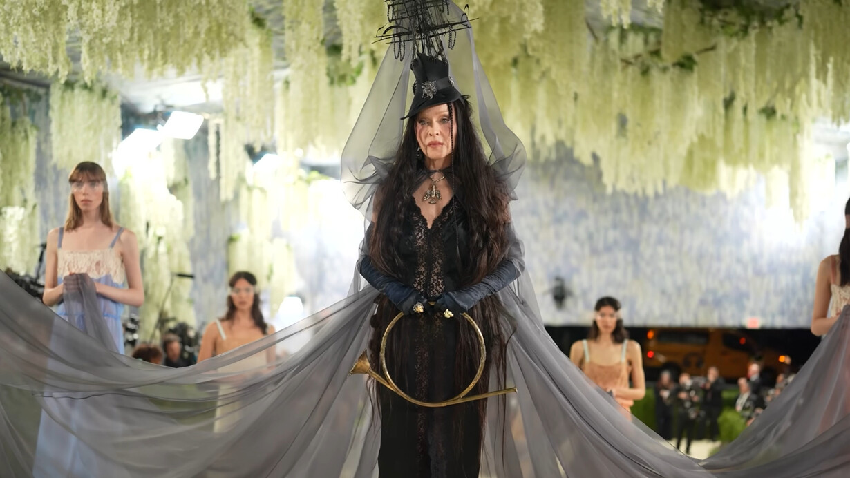 Madonna in custom Saint Laurent by Anthony Vaccarello, wearing a dramatic black lace ensemble with a sculptural ship-inspired headpiece and flowing veil during the 2026 Met Gala