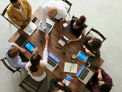 Team meeting with diverse participants exploring inclusive approaches to technology and data-driven systems