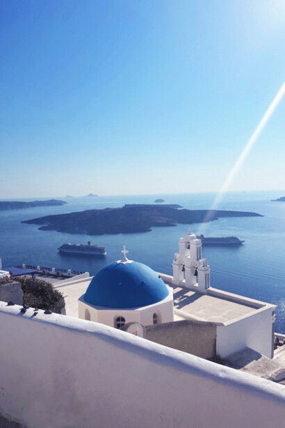 Blue dome buildings in Santorini, Greece during daytime