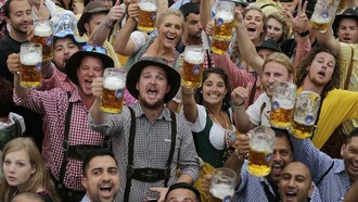 People celebrate Oktoberfest in traditional outfits