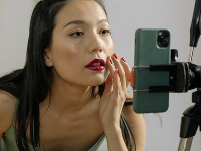 As she develops content on her phone, she integrates fresh ideas and trends from the latest industry discussions