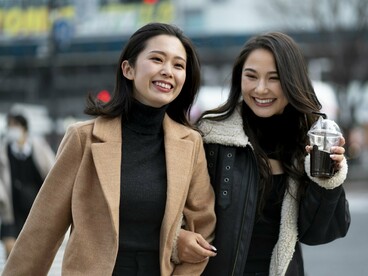 Plainly dressed Japanese women in neutral tones, symbolising the cultural preference for subtlety and restraint