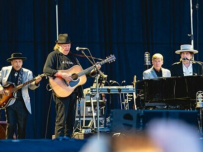 Bob Dylan and Neil Young’s band performing on stage during a live performance on Nowlan Park, Kilkenny, Ireland