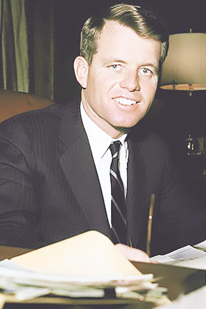 United States Attorney General Robert Kennedy working at his desk, 1961