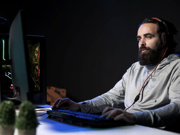 Gamer streaming a high-stakes online video game tournament