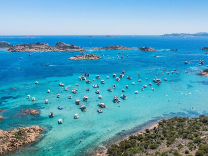 People swimming on beach during daytime, Sardinia, Italy