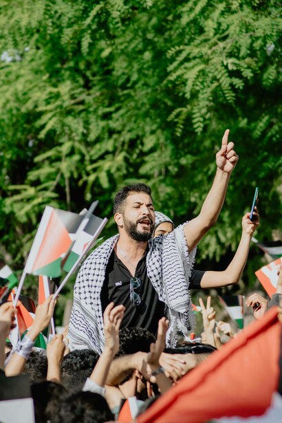 Flags of Palestine are waved in Tunis, Tunisia